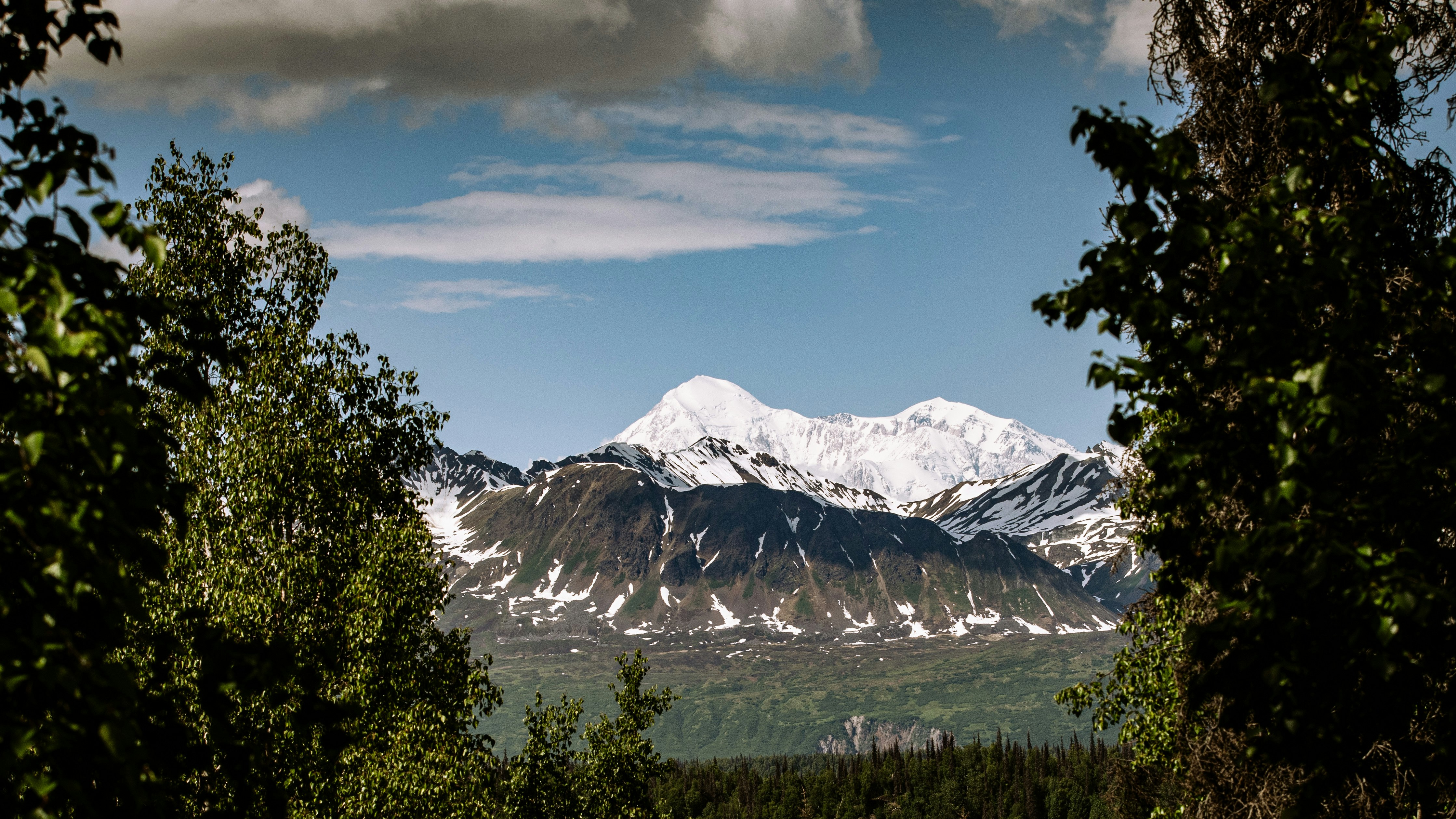 snow covered mountain under blue sky during daytime